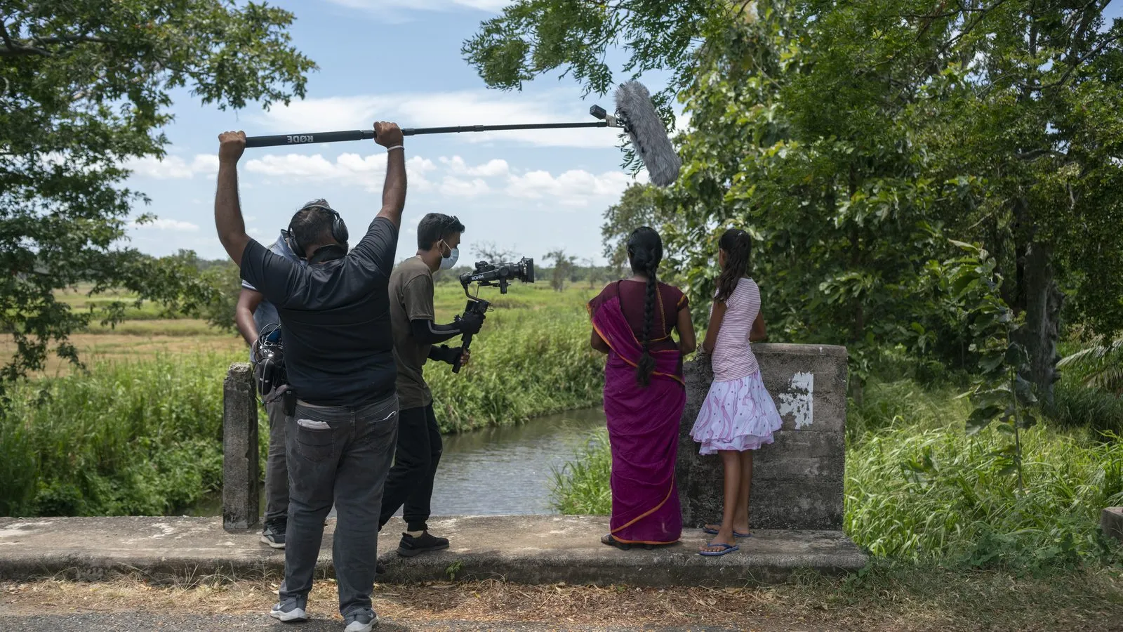 Boom operator and camera with a mother and daughter by the water in Sri Lanka